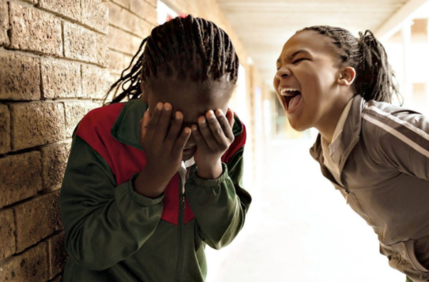 girl bullying another girl